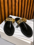 Moschino Metal Logo Lettering Thong Sandals.