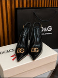 Dolce & Gabbana Lollo Slingback Pumps in black patent leather.
