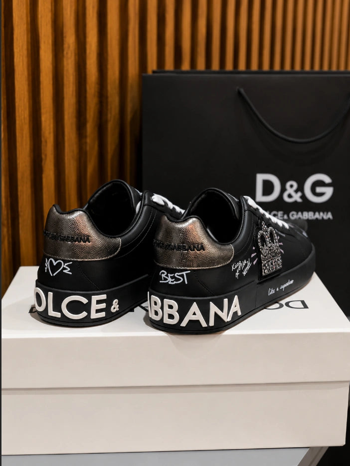 Dolce & Gabbana Portofino Crown Patch Leather Sneakers in the black and silver print colorway.