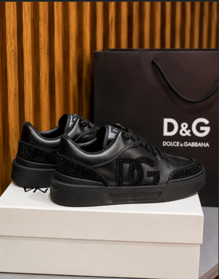 Dolce & Gabbana New Roma Rhinestone-Embellished Leather Sneakers in the Triple Black colorway.