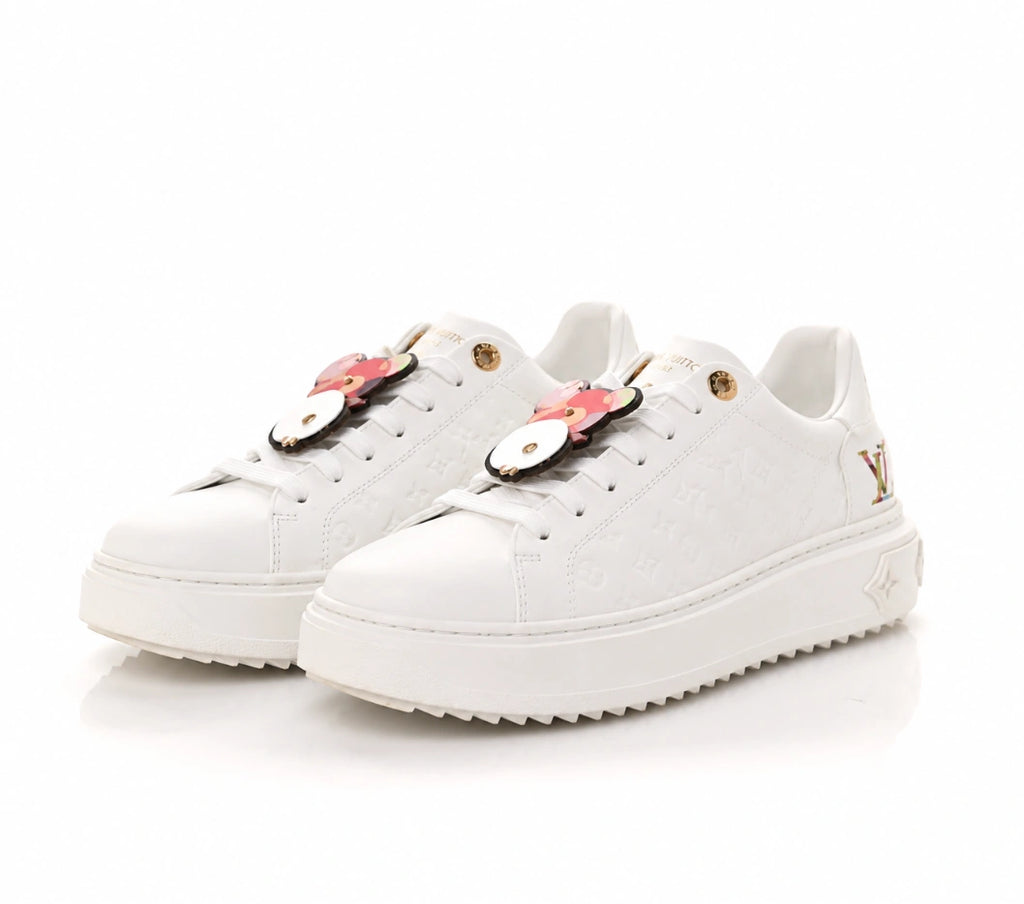 Louis Vuitton Time Out Sneakers in All-White Monogram Leather with Gold Accent.