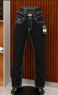 True Religion Ricky Straight Jeans featuring a monochromatic black wash with sharp contrast stitch detailing.
