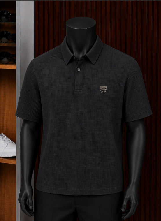 Ferragamo structured knit polo shirt showcased on a minimalist charcoal male mannequin.