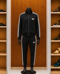 Adidas Originals Adicolor Classics Firebird Tracksuit in black and white.