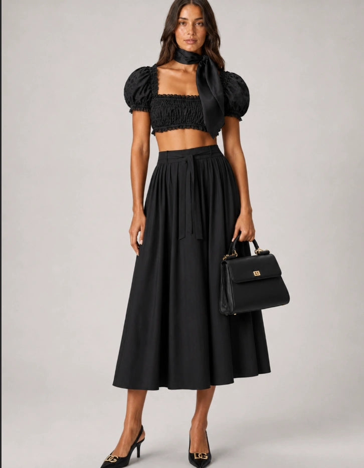 Dolce & Gabbana Lollo Slingback Pumps in black patent leather.