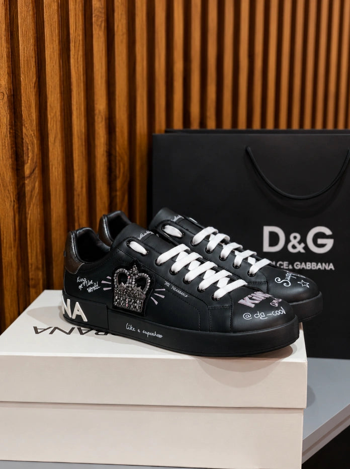 Dolce & Gabbana Portofino Crown Patch Leather Sneakers in the black and silver print colorway.