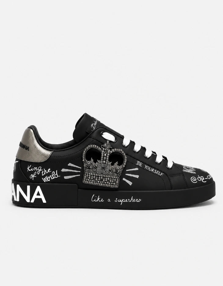 Dolce & Gabbana Portofino Crown Patch Leather Sneakers in the black and silver print colorway.