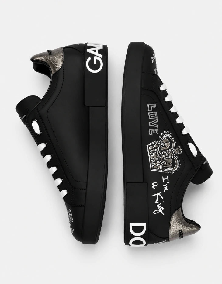 Dolce & Gabbana Portofino Crown Patch Leather Sneakers in the black and silver print colorway.