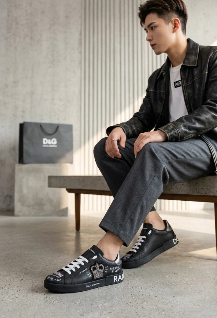 Dolce & Gabbana Portofino Crown Patch Leather Sneakers in the black and silver print colorway.