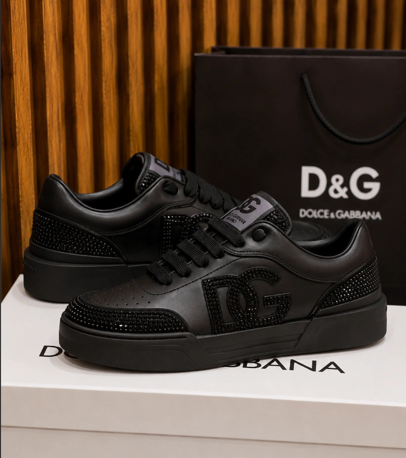 Dolce & Gabbana New Roma Rhinestone-Embellished Leather Sneakers in the Triple Black colorway.