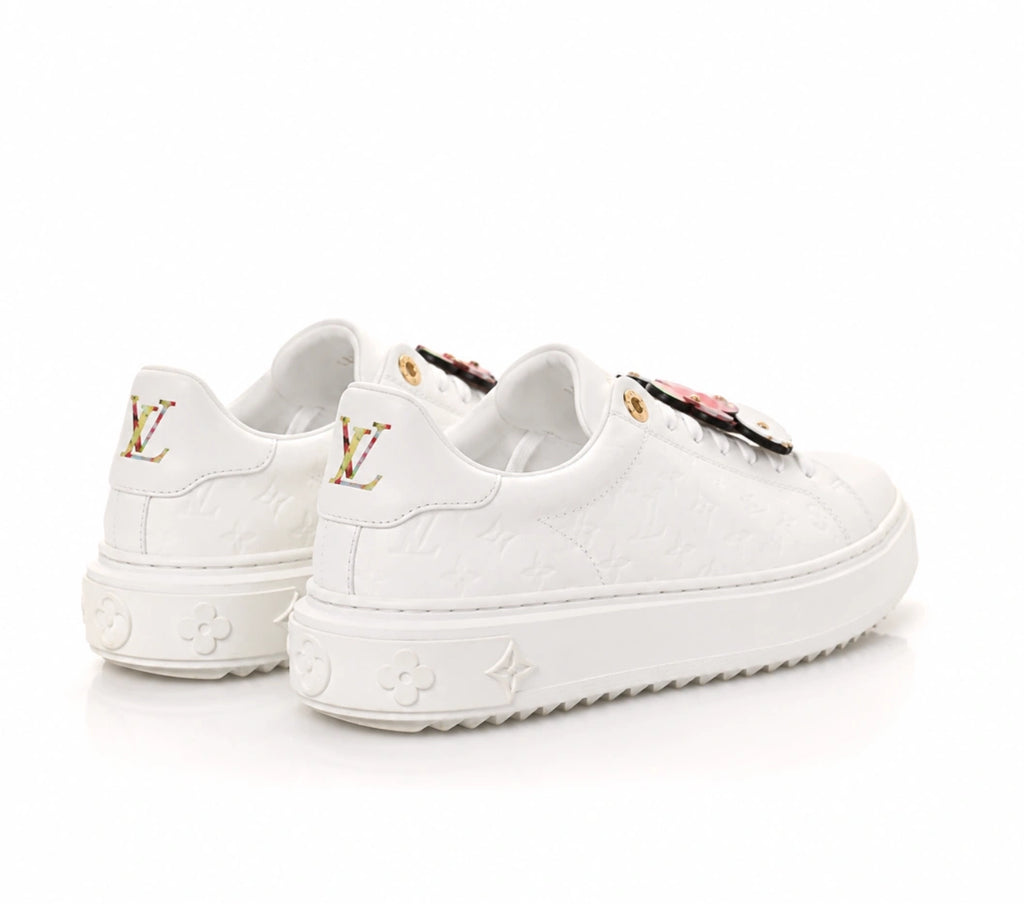 Louis Vuitton Time Out Sneakers in All-White Monogram Leather with Gold Accent.
