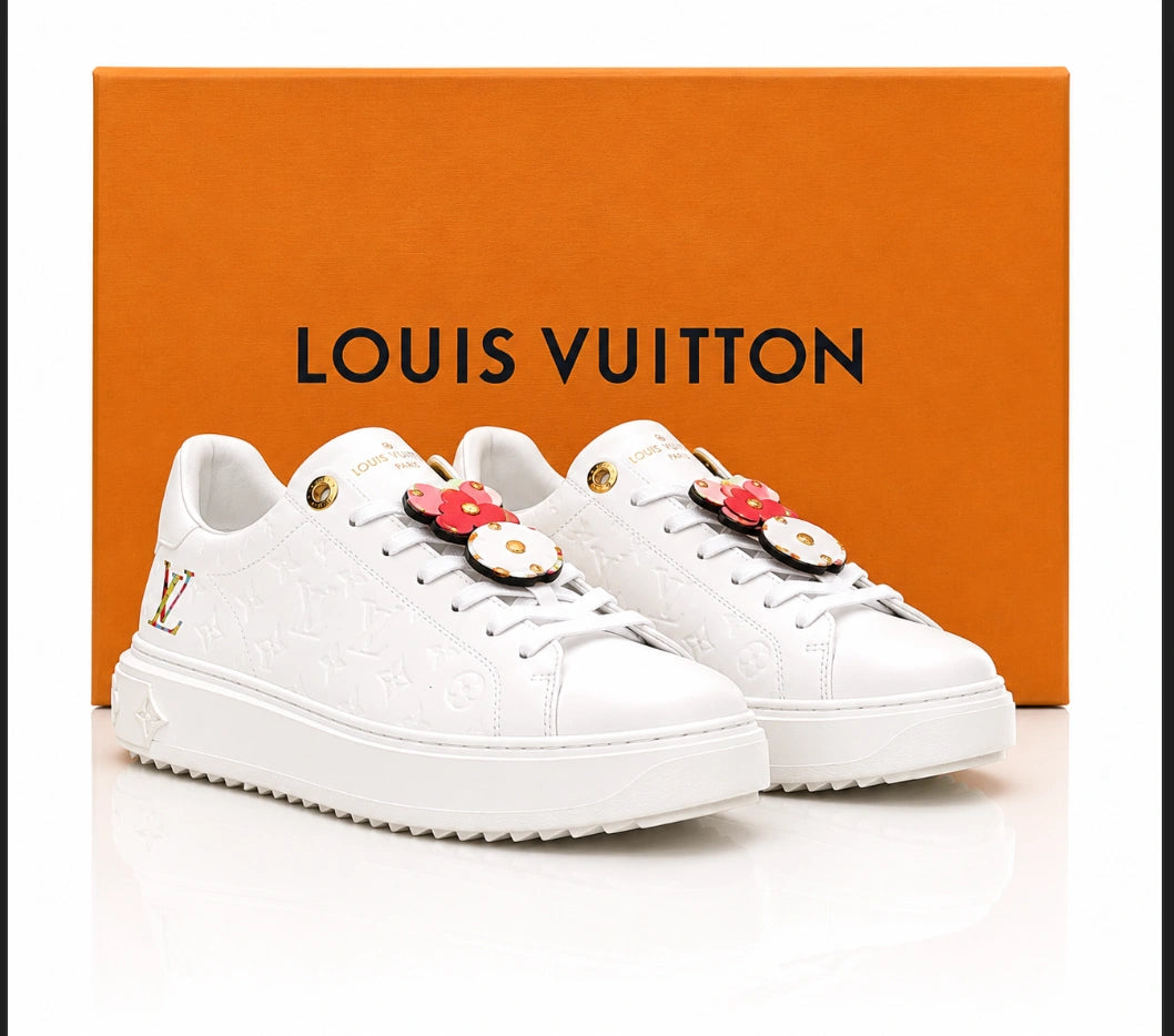 Louis Vuitton Time Out Sneakers in All-White Monogram Leather with Gold Accent.