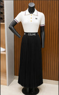 CELINE Cropped Polo in Ribbed Cotton (Off-White/Cream colorway) +  CELINE Logo Waistband Pleated Midi Skirt (Black colorway)