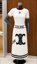 CELINE Short-Sleeved Crewneck Knit Top in Striped Cotton + CELINE Triomphe Pleated Midi Skirt with Branded Waistband.